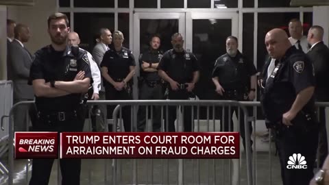 Donald Trump enters New York City courtroom following arrest processing