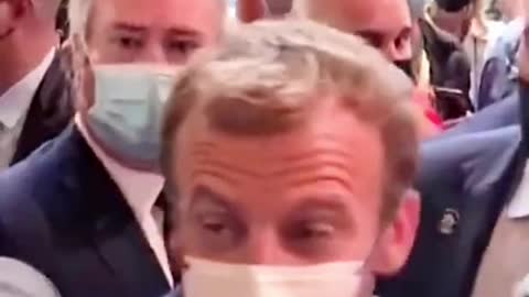 A person throws an egg at Macron while visiting Lyon