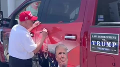 Trump signing truck