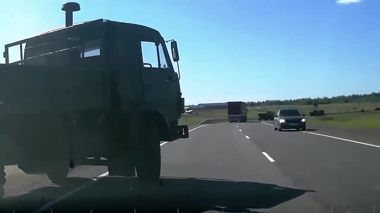 Truck Towing another Truck gets pushed of Road by Overtaking Truck