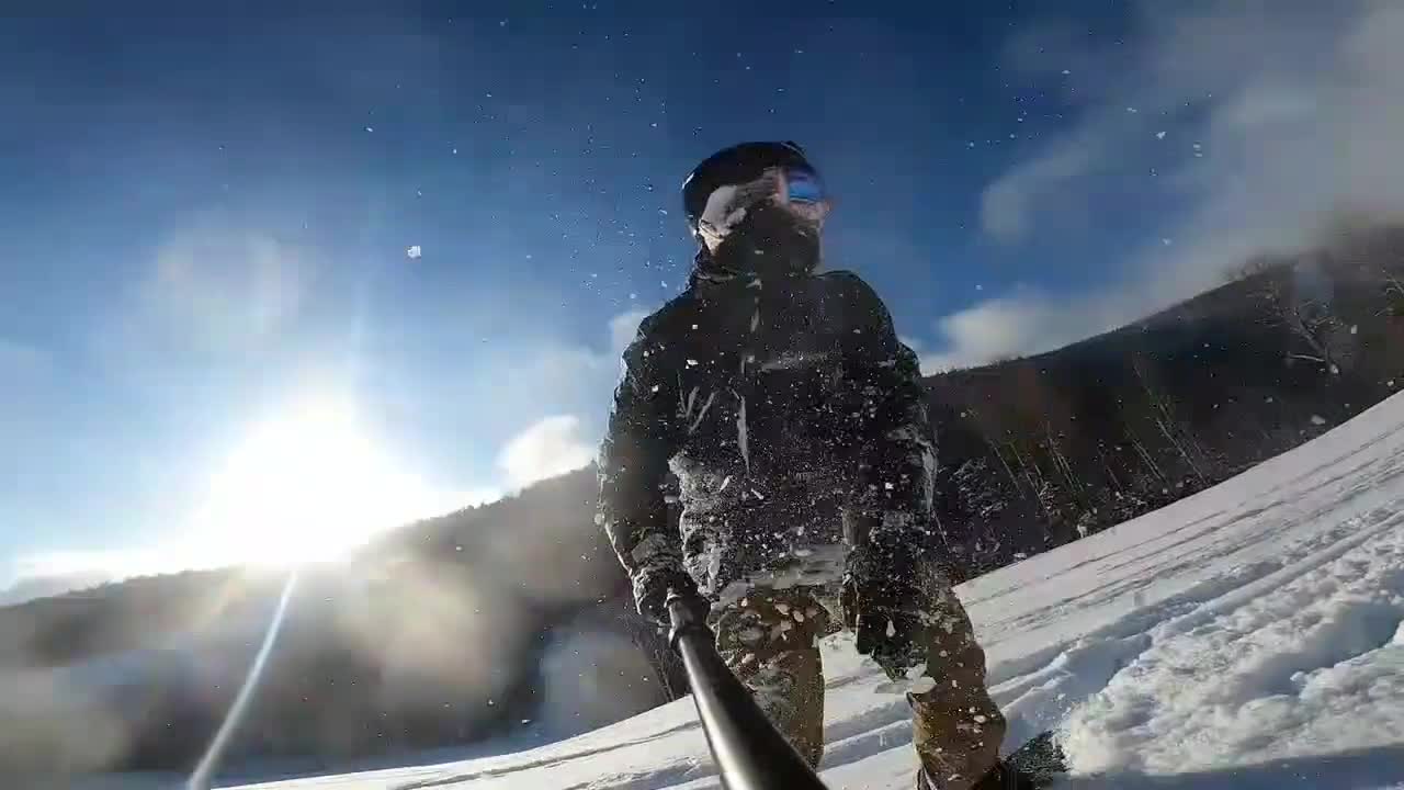 A GoPro Captures a Snowboarder Hard Slipping