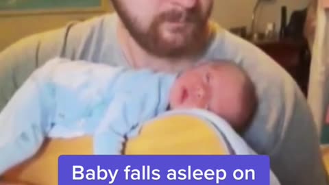 Baby falls asleep on top of dad's guitar