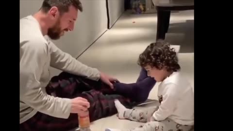 Messi playing with his son