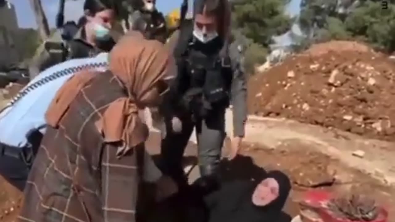 Palestinian Mother dragged from Son's grave as Israel demolishes cemetery to build a Theme Park