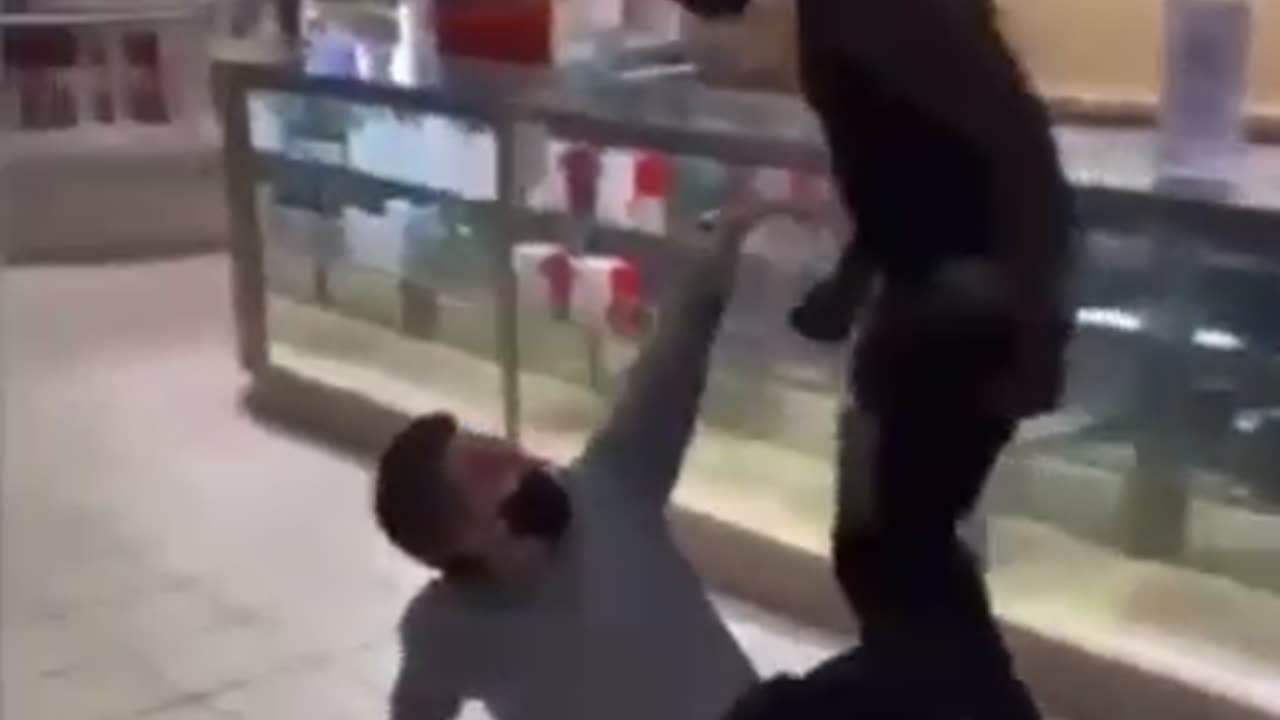 Man Randomly Beats Up Another Guy In Clothing Store