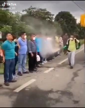 Ecuador Covid Protection, disinfecting passengers before entering the bus