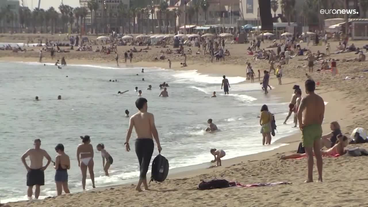 People flock to the beach as France and Spain experience unusually hot October