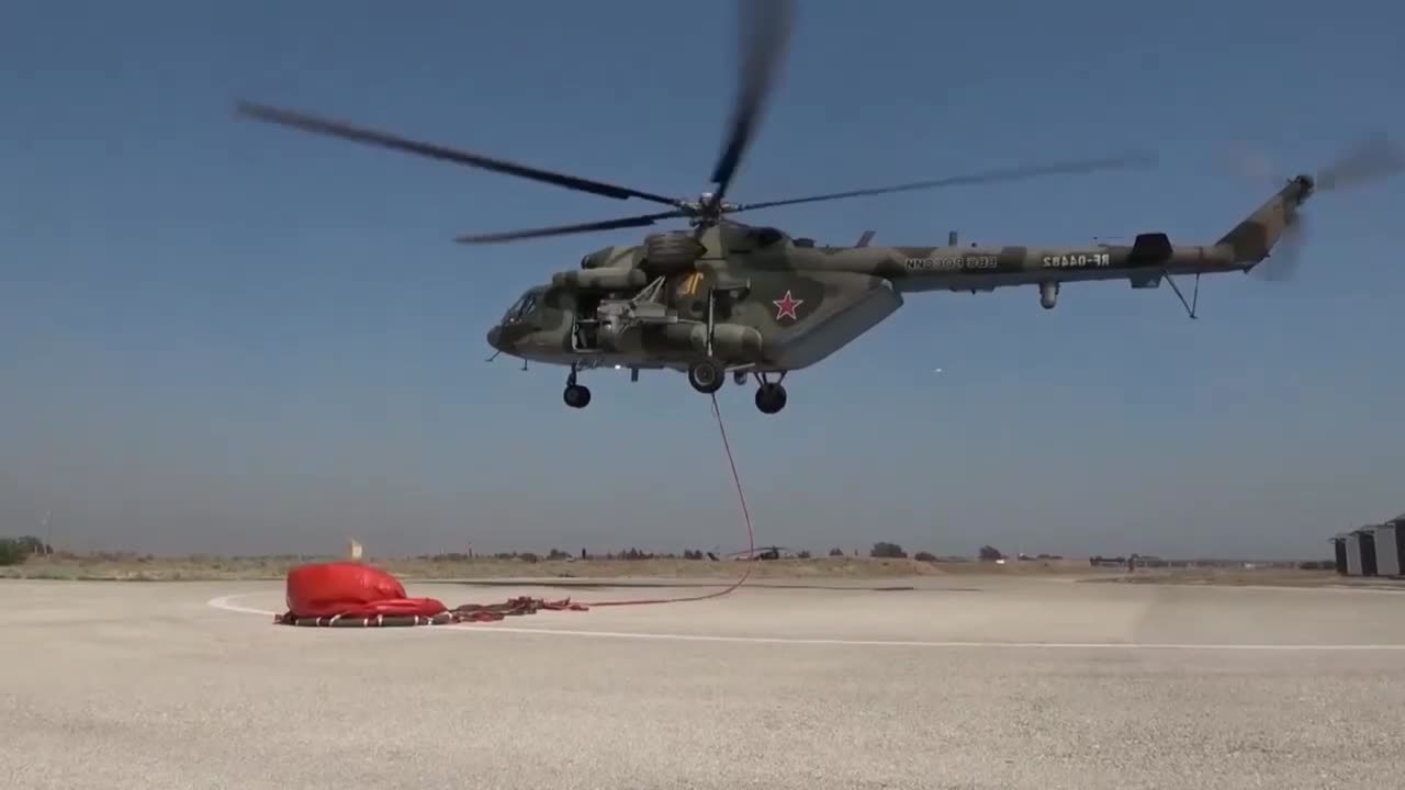 The crew of the Russian Mi-8AMTSh helicopter fights fires in Syria