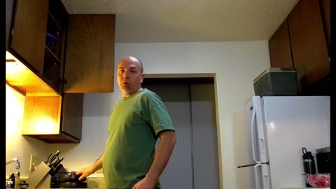 Bald Angry and Cooking Sausage