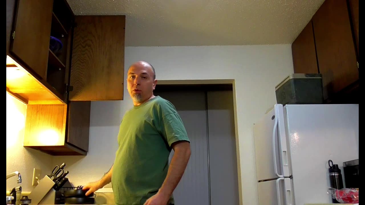 Bald Angry and Cooking Sausage