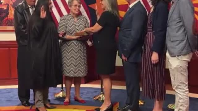 Katie Hobbs laughs and stammers while taking the oath of office