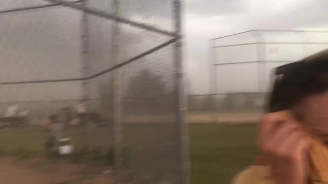 Softball Game Interrupted by Intensely Strong Winds