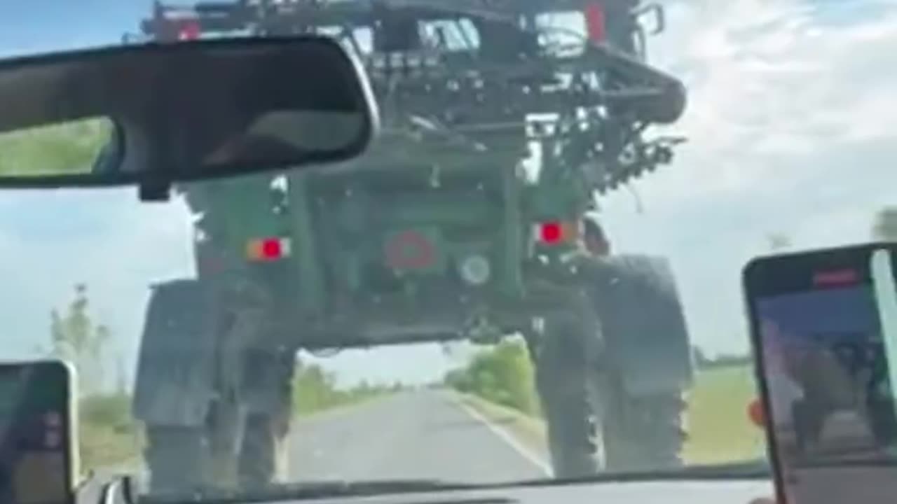 Car Drives Under Sprayer Machine