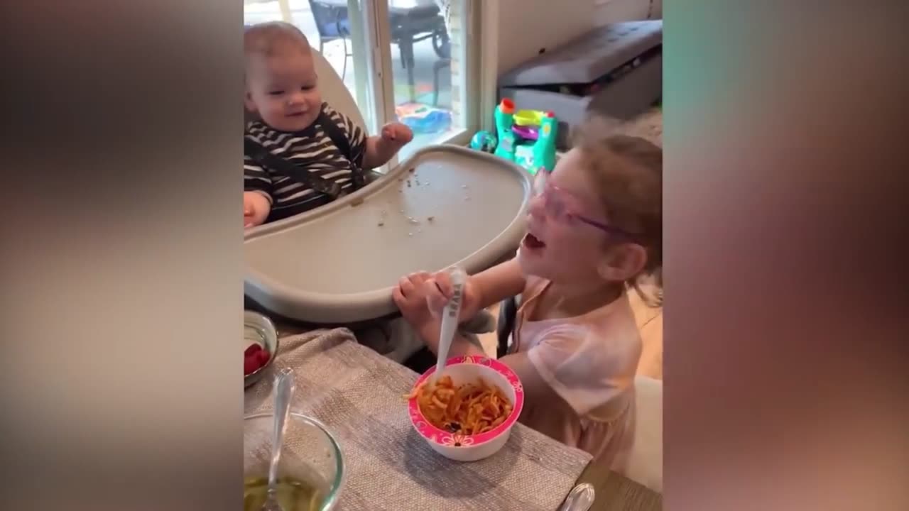 Sister feeds her younger brother, so cute and amazing