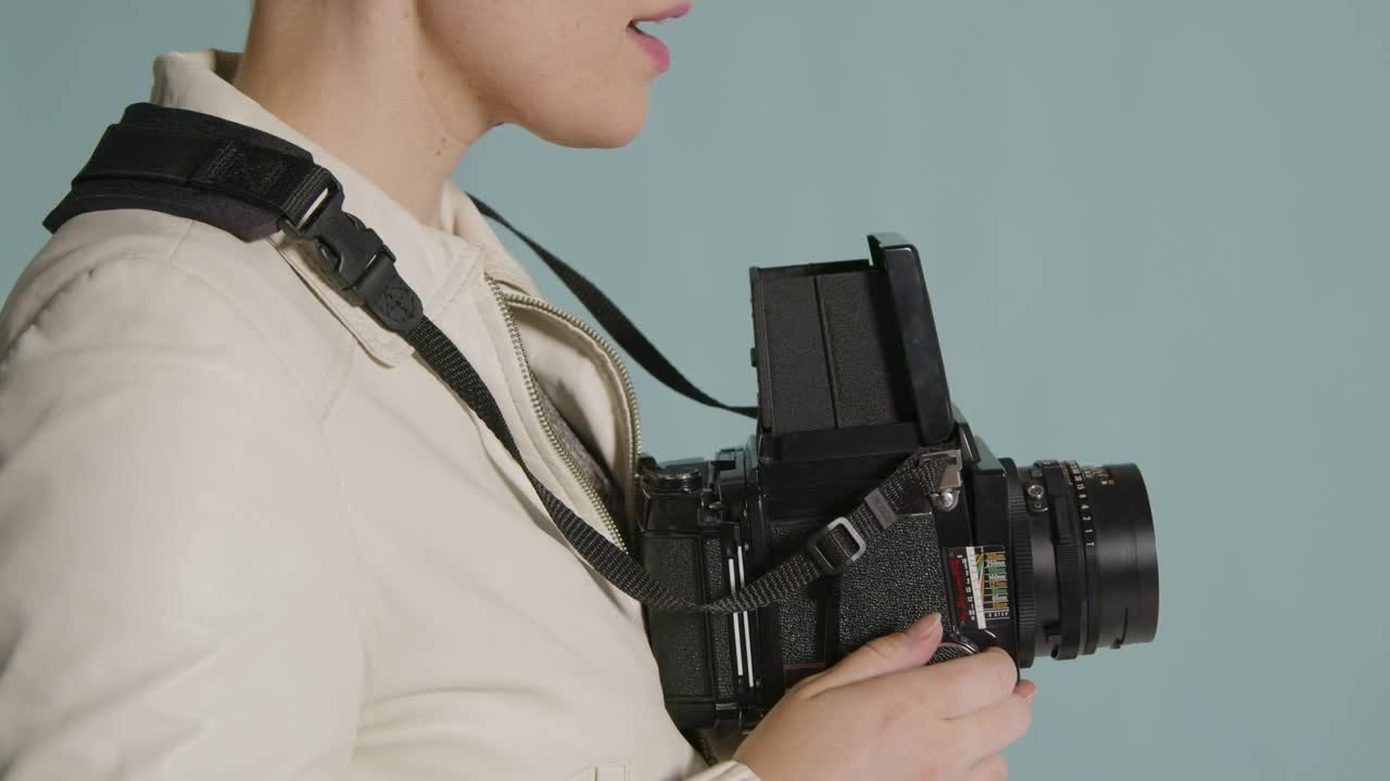 Side view of photographer using medium format camera 02