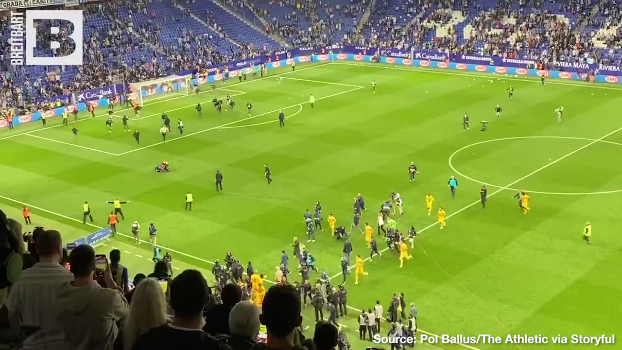 A story of two fan bases: Espanyol supporters invade the pitch, while Barcelona fans chant joyously