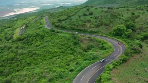 Road surrounded by mountains