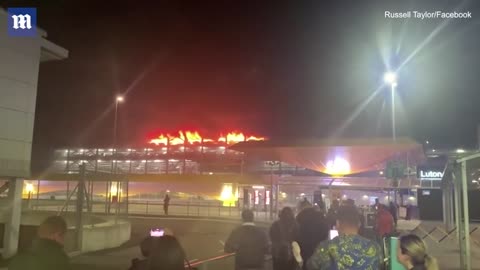 Dramatic moment a car explodes causing Luton Airport car park to set ablaze and collapse