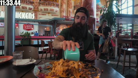 ATTEMPTING AN UNEXPECTEDLY SPICY NACHO MOUNTAIN CHALLENGE | BeardMeatsFood