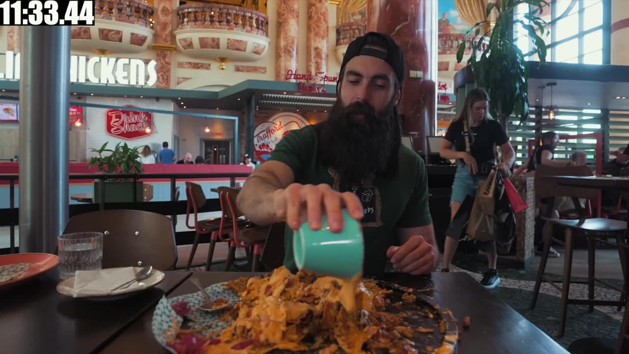 ATTEMPTING AN UNEXPECTEDLY SPICY NACHO MOUNTAIN CHALLENGE | BeardMeatsFood
