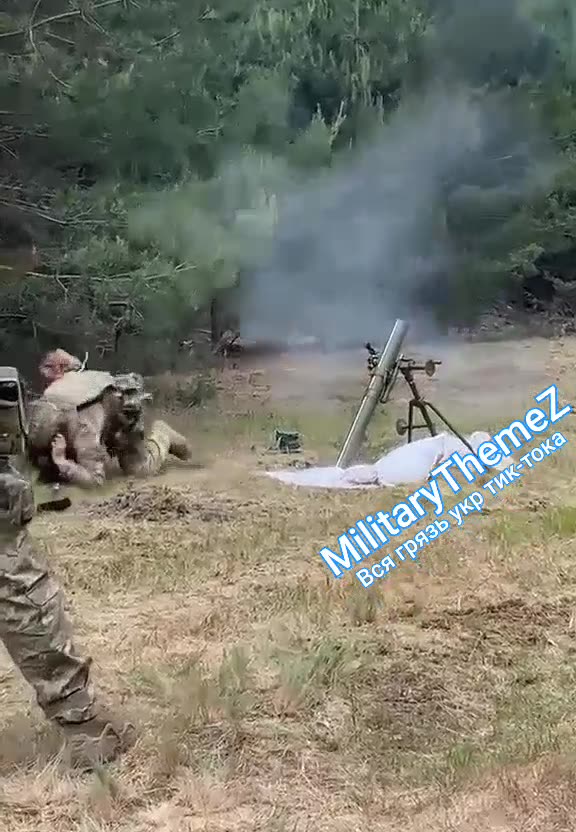 Ukraine soldier with Bandera patch uses shovel to fire weapon