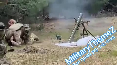 Ukraine soldier with Bandera patch uses shovel to fire weapon