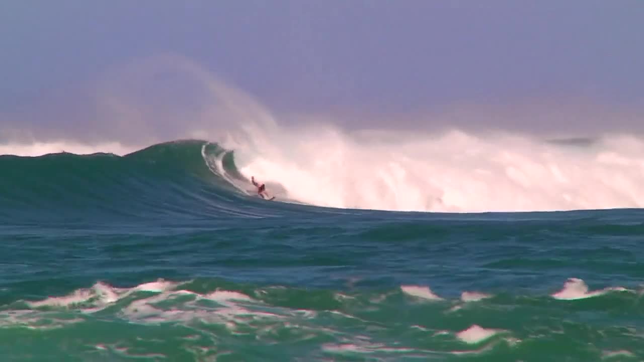 amazing man surfing the wave