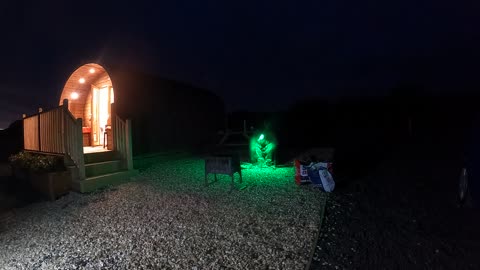 Preparing the campfire. Next to a glamping pod. Nightlapse