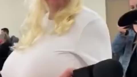 Dave Menzies with Rebel News dressed as a big breasted woman