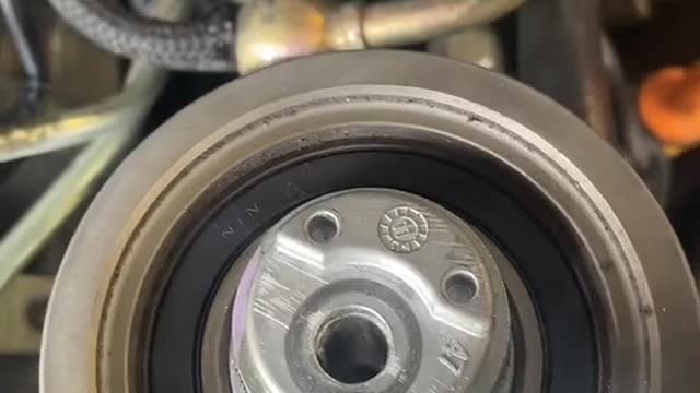 Automotive engine belt mounting automotive engine