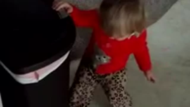 Toddler discovers joys of trash can