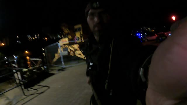 Adjusting camera of the Go pro at Tenby harbour. At night..Oct 2022