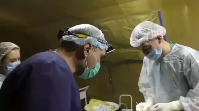 Russia military healthcare professionals in action at field surgery unit