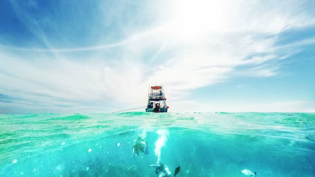 Divers And Boat In The Caribbean Sea Loop Video No Copyright