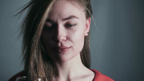 Beautiful girl drinks wine.