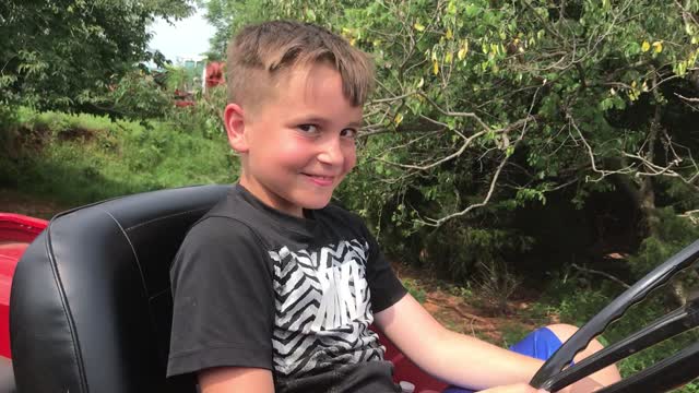 My Son driving our 1958 CJ5, Ol' Rusty.