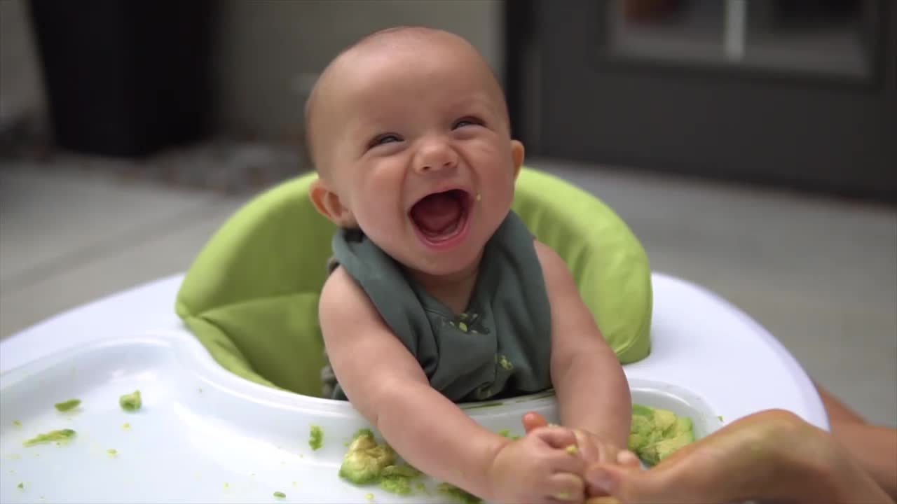 cute baby burst into laughing with his mom