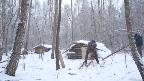 Dugout shelter in winter forest, Cozy and warm night with a stove