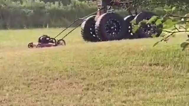 Guy Attaches Lawn Mower to Monster Truck and Cuts Grass While Driving it