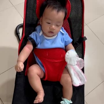 My baby playing on swing chair