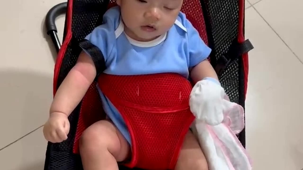 My baby playing on swing chair