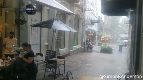 Coffee at a café as the heavens erupt