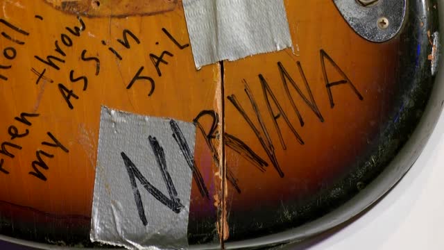 Cobain's guitar, Lennon's glasses go up for auction