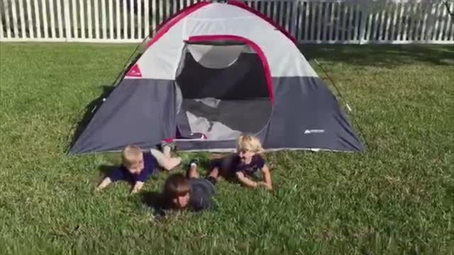 Five boys trip on tent