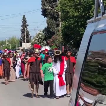 Flashback: Boy With Down Syndrome Comforting Jesus During a Good Friday Procession In Mexico