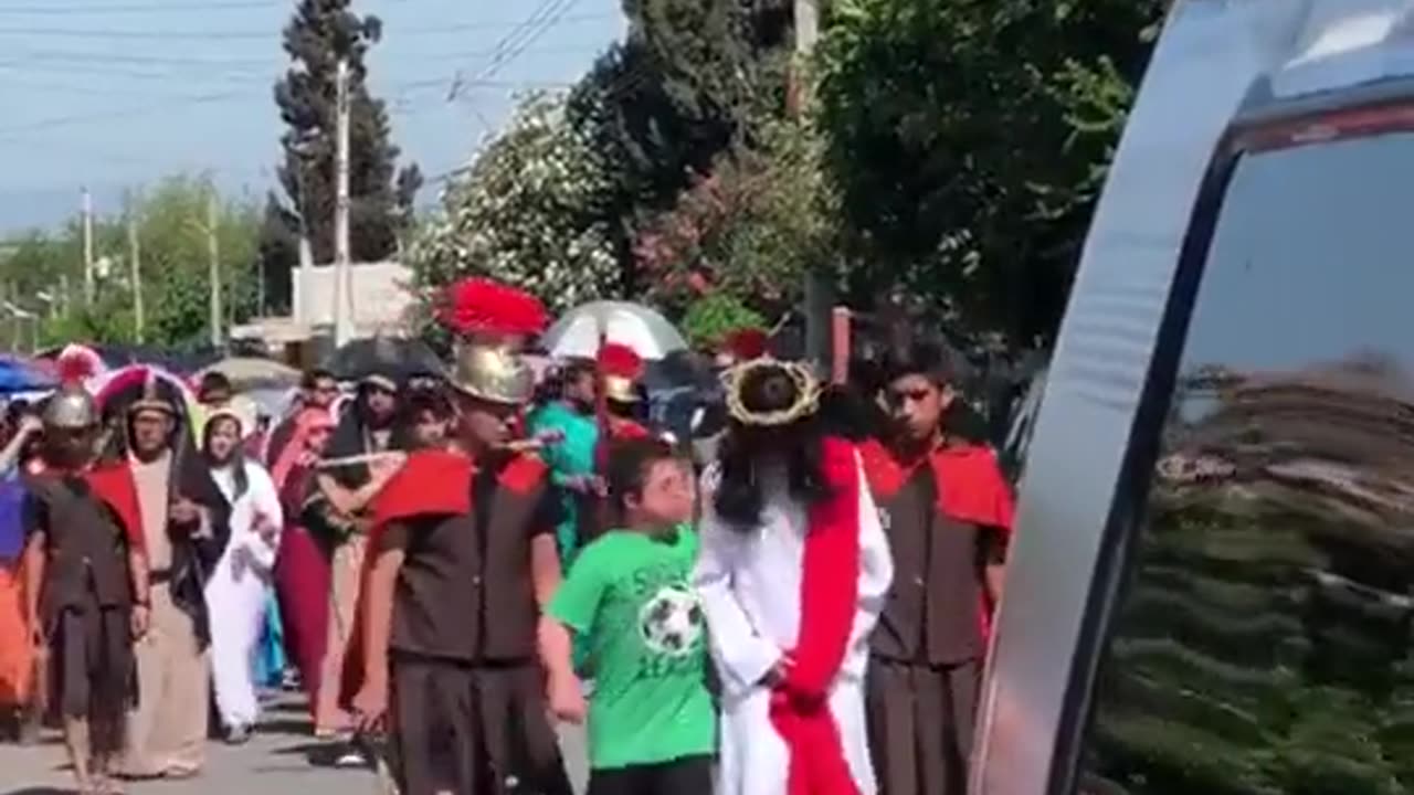 Flashback: Boy With Down Syndrome Comforting Jesus During a Good Friday Procession In Mexico