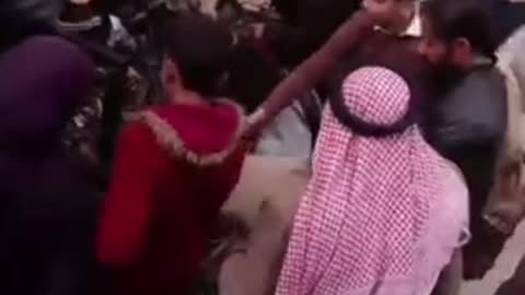 HTS Militants Hand Out Weapons to Children