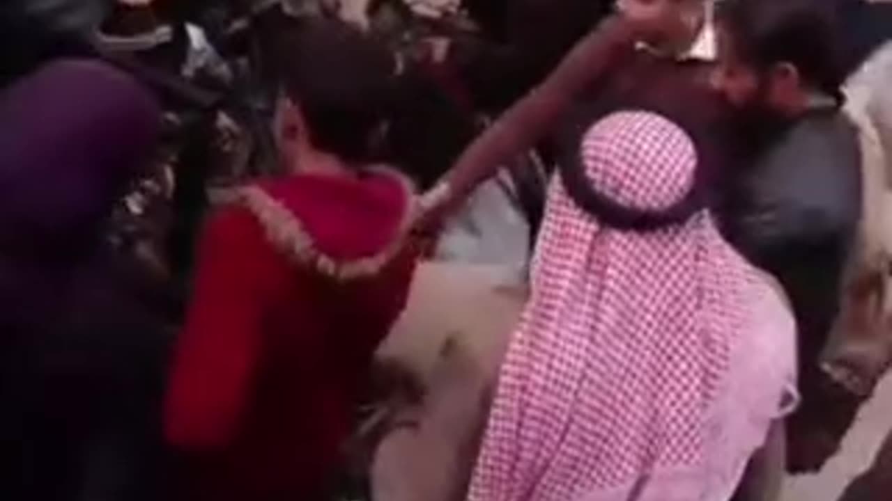 HTS Militants Hand Out Weapons to Children