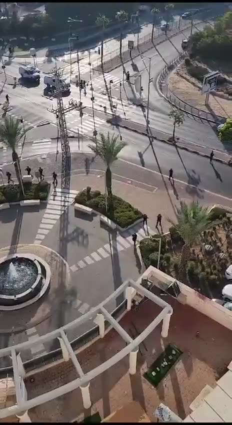 Palestinian fighters entering an Israeli Neighborhood