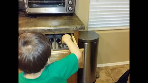 3-year-old helps set the table